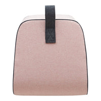 Soft pink bag with a textured finish and black trim, featuring a sturdy black handle for added style.