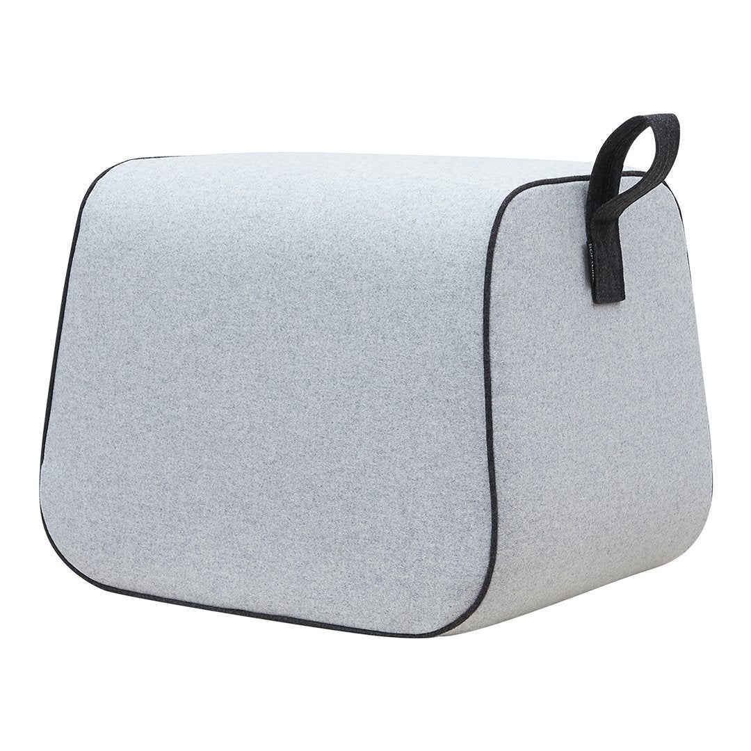 Gray fabric storage cube with a smooth texture and black trim, featuring a minimalist design. Perfect for organization.