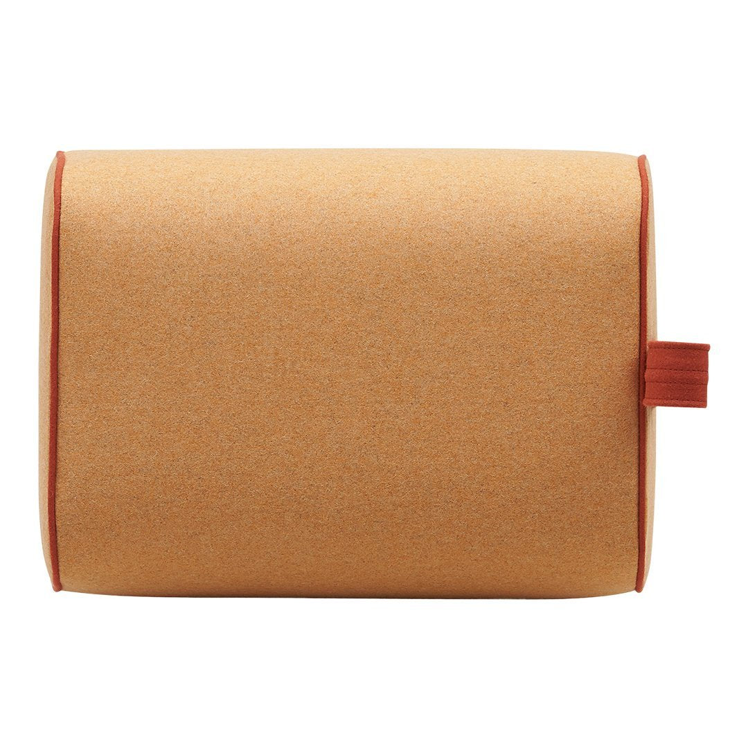 Orange cork pillow with contrasting red stitching and handle, offering a modern, minimalist design.