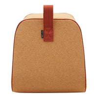 Orange and tan bag with a smooth texture and contrasting brown handle, featuring a minimalist design.