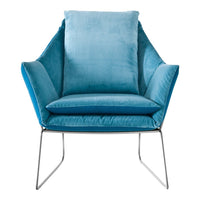 Modern chair in soft teal velvet with sleek silver legs, featuring smooth, contoured shapes and plush cushioning.