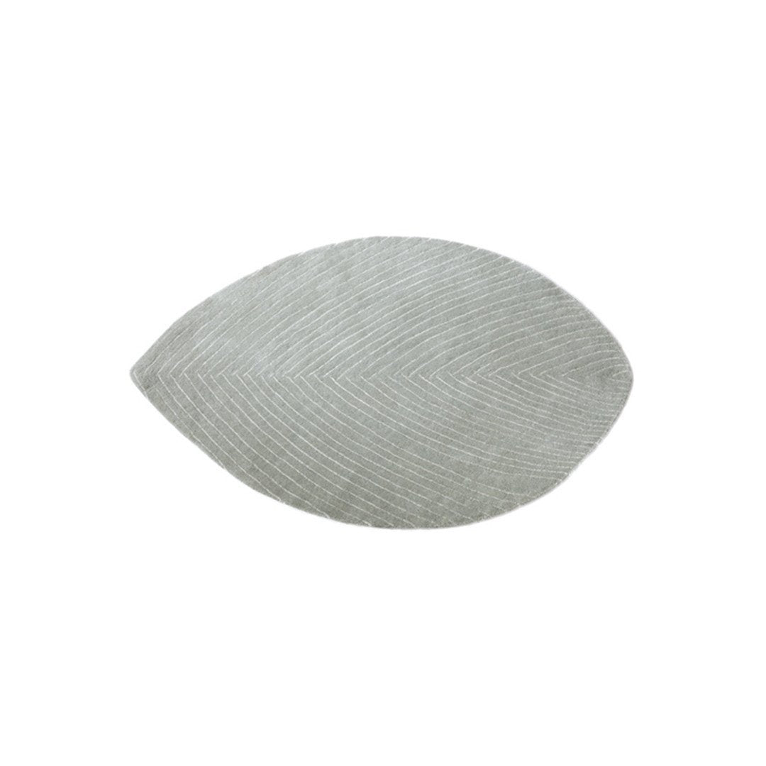 Textured oval pillow in soft gray with subtle linear patterns for modern home decor.