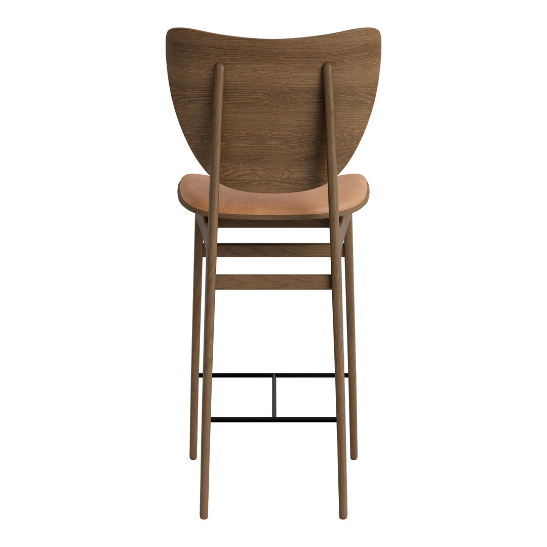 Wooden bar stool with a natural wood finish, curved backrest, and minimalistic black metal base.