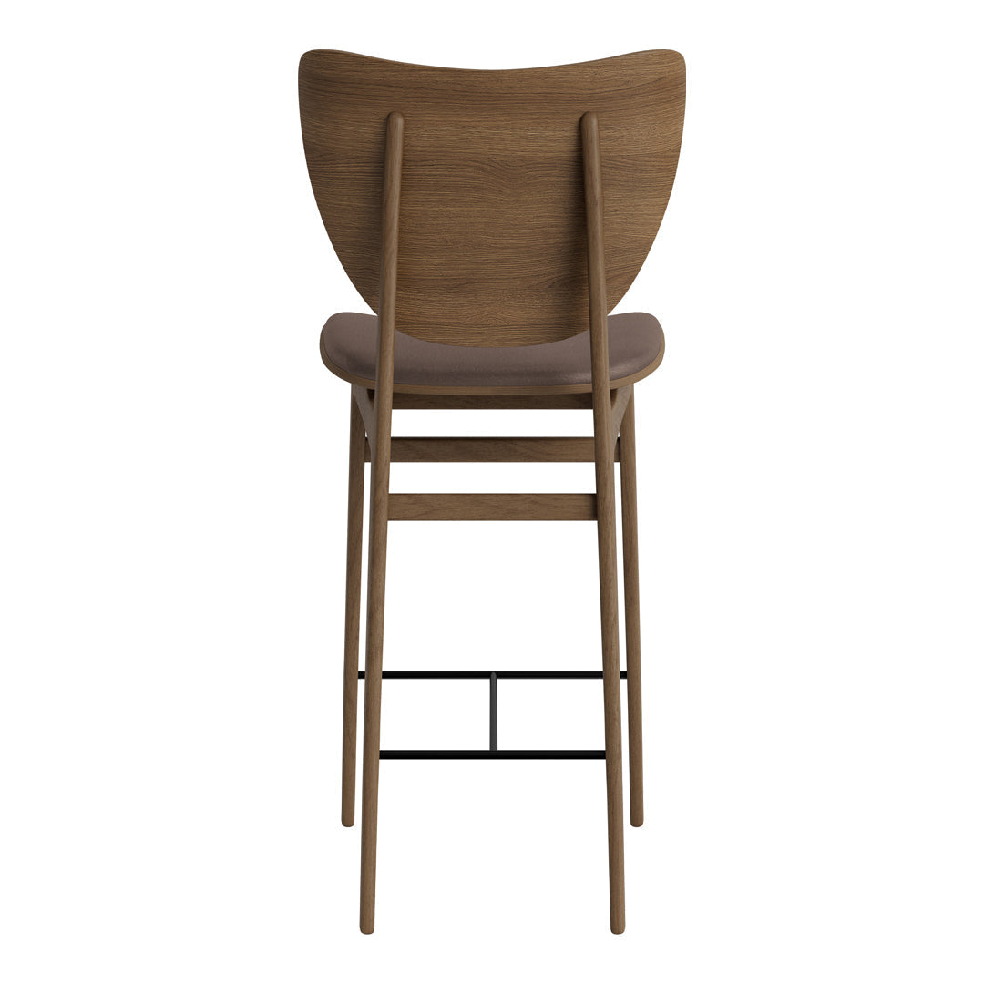 Back of a wooden bar chair in warm brown tones with a smooth, minimalist design.