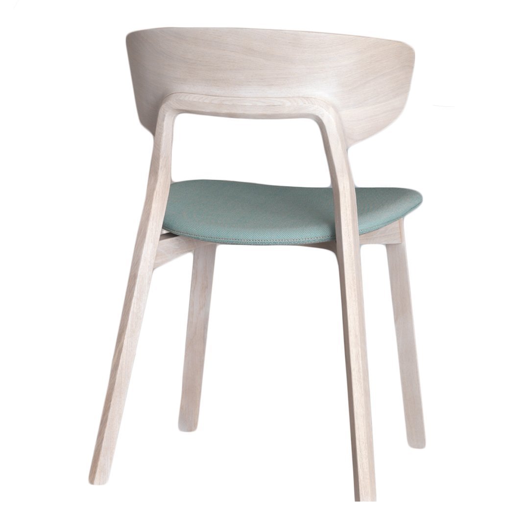 Light wood chair with a smooth finish and soft mint green cushioned seat. Simple, modern design.
