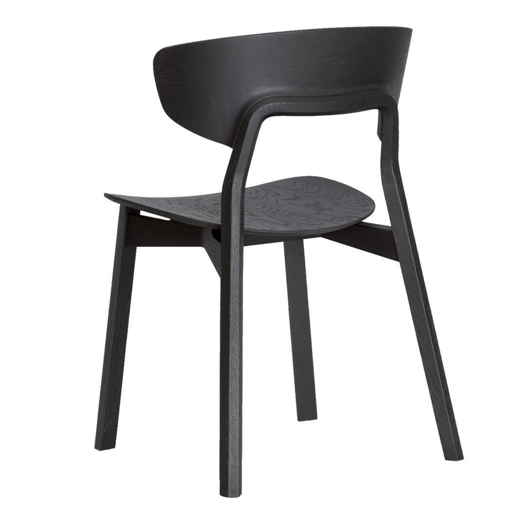 Black wooden chair with a smooth, minimalist design and curved backrest, showcasing a contemporary aesthetic.