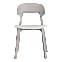 Minimalist light gray wooden chair with a smooth white seat, featuring a simple and modern design.