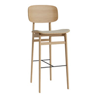 Natural wood bar stool with a smooth, minimalist design and subtle grain pattern, featuring a black metal footrest.