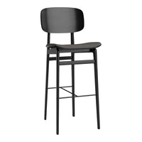 Sleek black bar stool with a minimalistic design and smooth matte finish. Elegant and modern home decor piece.