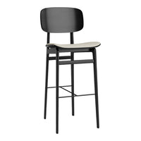 Black bar stool with a smooth, light gray seat and minimalist design, perfect for modern decor.