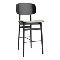 Black metal bar stool with a sleek, minimalist design and a light gray seat. Ideal for modern interiors.