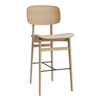 Natural wood bar stool with a light cream upholstered seat, featuring a minimalist design and clean lines.