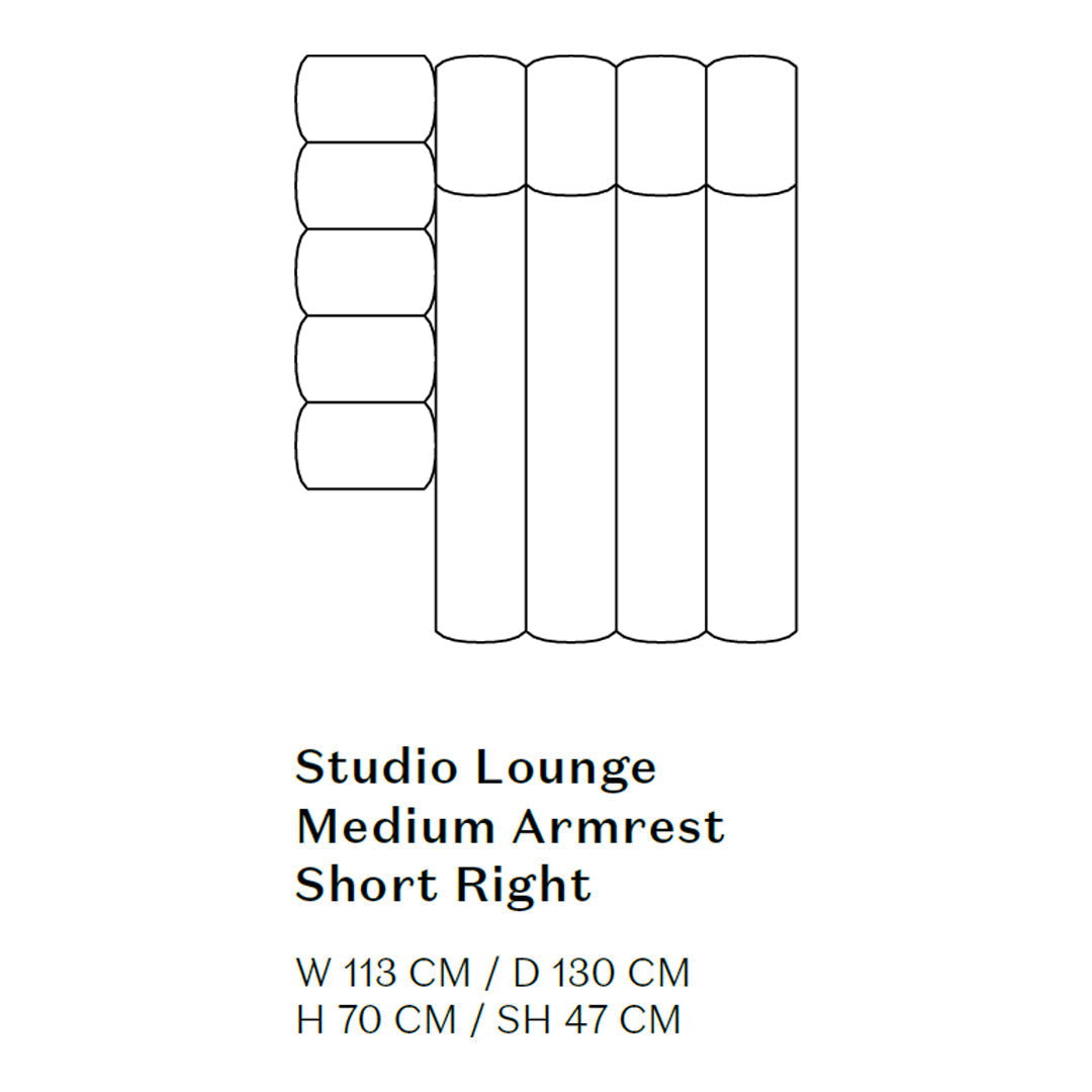 "Modern lounge sofa in soft gray with smooth cylindrical cushions, featuring a minimalistic design."