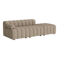 Beige curved sofa with horizontal ridges, adding modern texture and style to any living space.