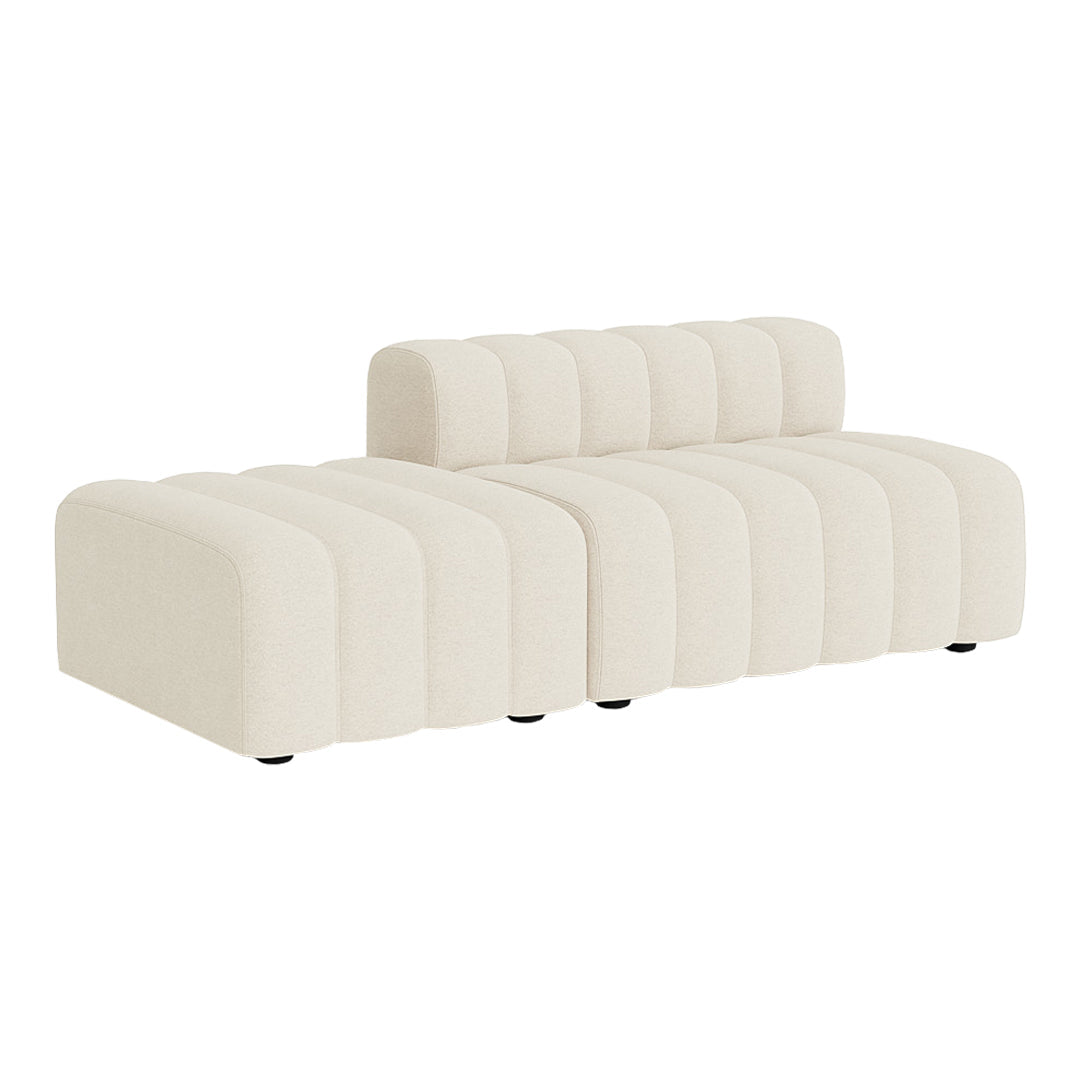 Beige ribbed sofa with a modern design, featuring a chic tufted backrest and minimalist silhouette.