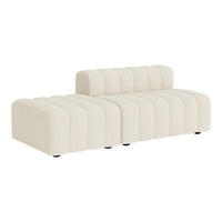 Beige ribbed sofa with a modern design, featuring a chic tufted backrest and minimalist silhouette.