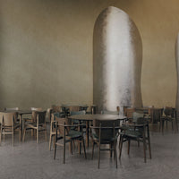 Neutral tones with textured walls and sleek, modern wooden furniture in earthy greens and browns.