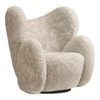 Cream-colored plush chair with a soft, textured, fluffy design and rounded, organic shapes. Ideal for cozy interiors.