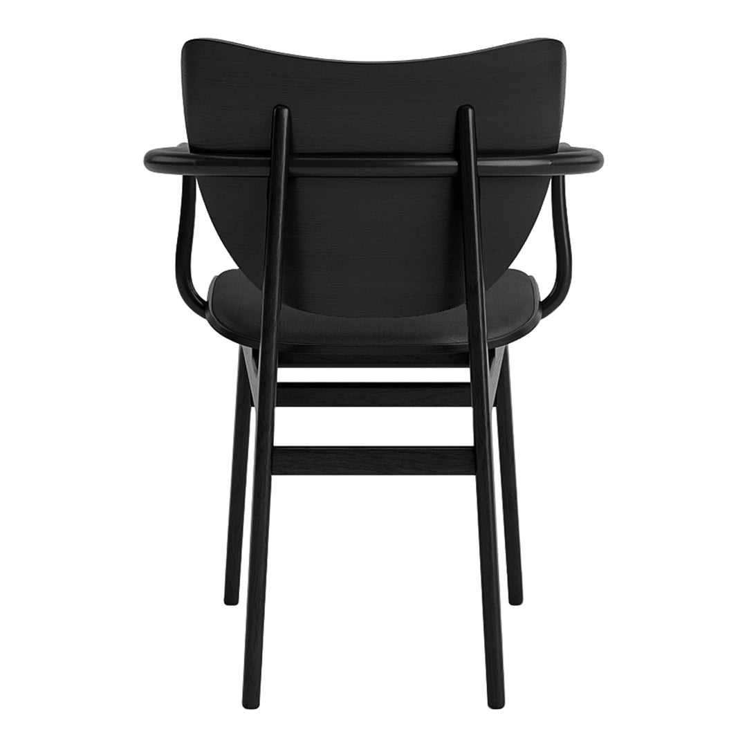 Stylish black chair with sleek curves and minimalist design, featuring a smooth black finish and clean lines.