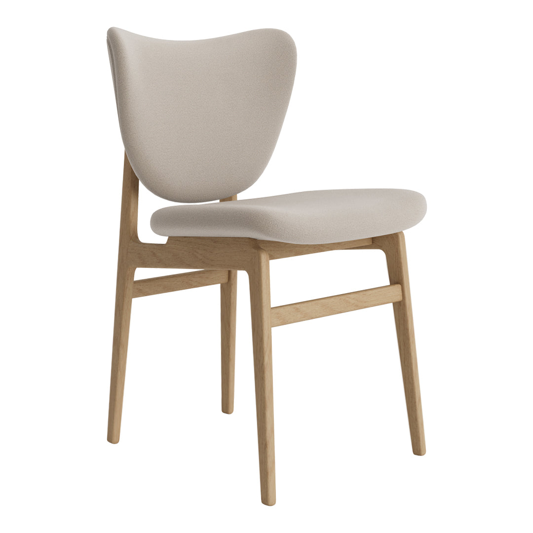 Light beige upholstered chair with natural wood legs, featuring a smooth, minimalist design and soft curves.