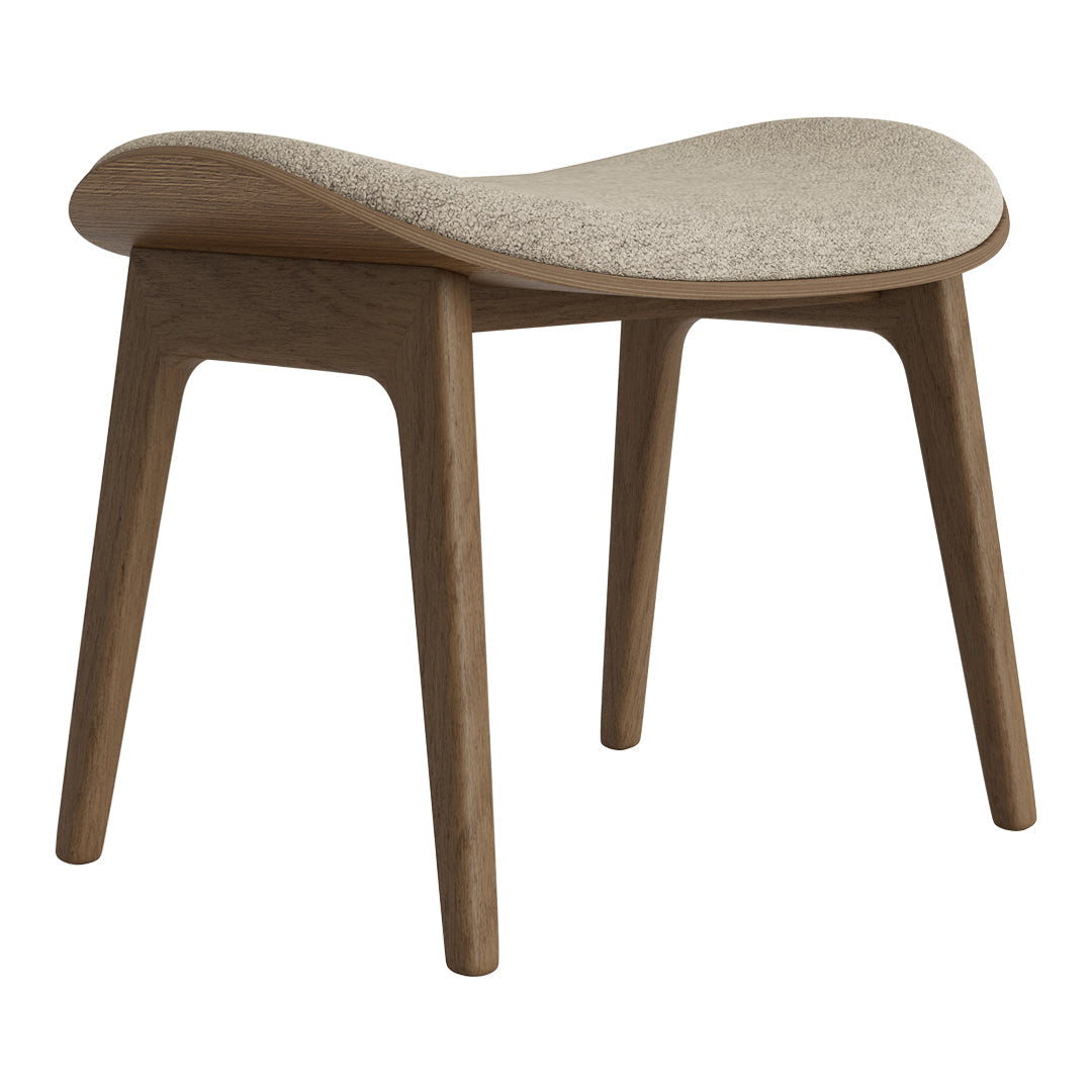 Light beige cushion on a natural wood stool with curved design and clean lines, perfect for modern decor.