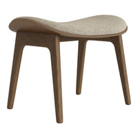 Light beige cushion on a natural wood stool with curved design and clean lines, perfect for modern decor.