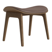 Brown cushioned stool with a smooth, curved top and natural wood legs, showcasing a minimalist design.