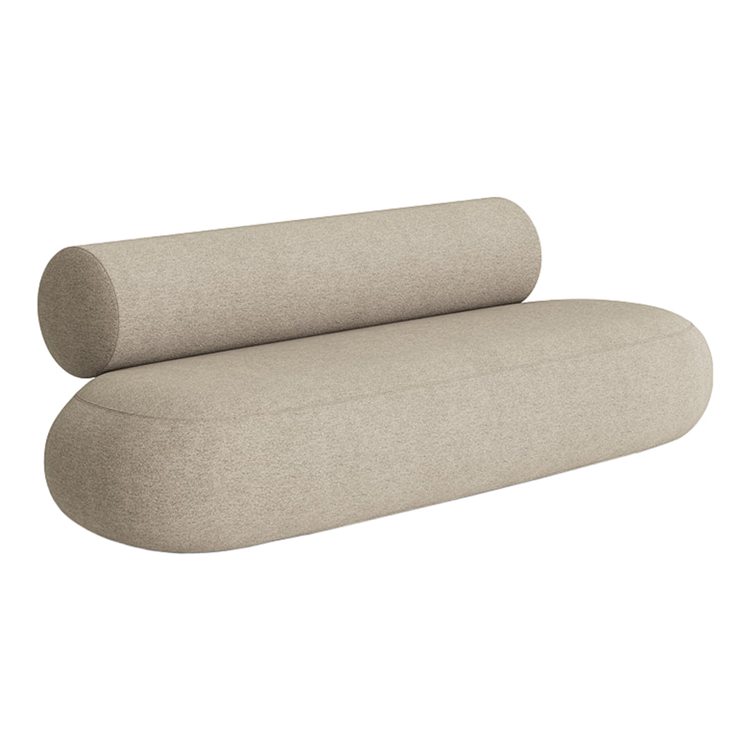 Beige modern sofa with a rounded design and textured fabric, featuring a cylindrical bolster pillow.