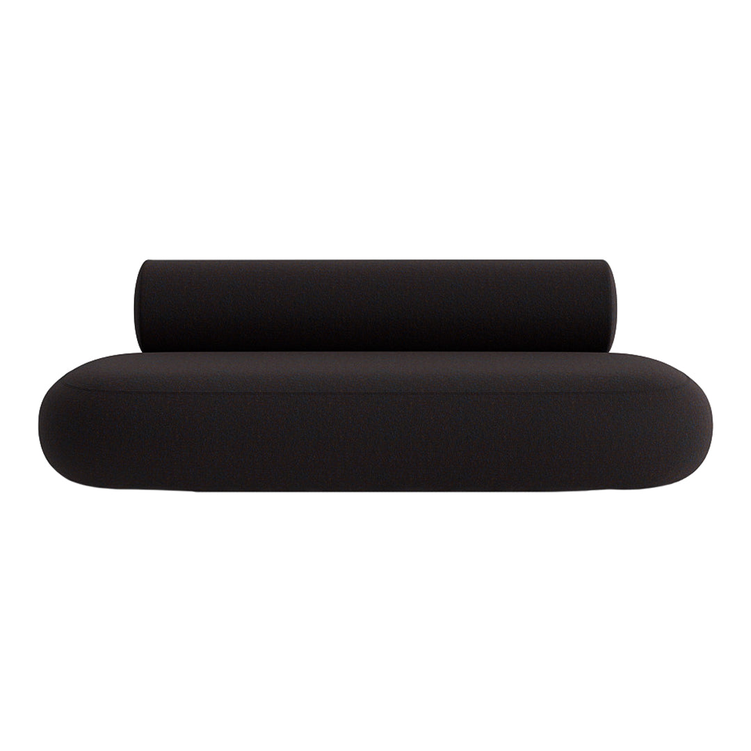 Black modern sofa with smooth curves and a minimalist design, featuring a sleek cylindrical cushion.