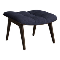 Navy blue tufted upholstery with dark wooden legs, offering a modern and stylish accent to any space.