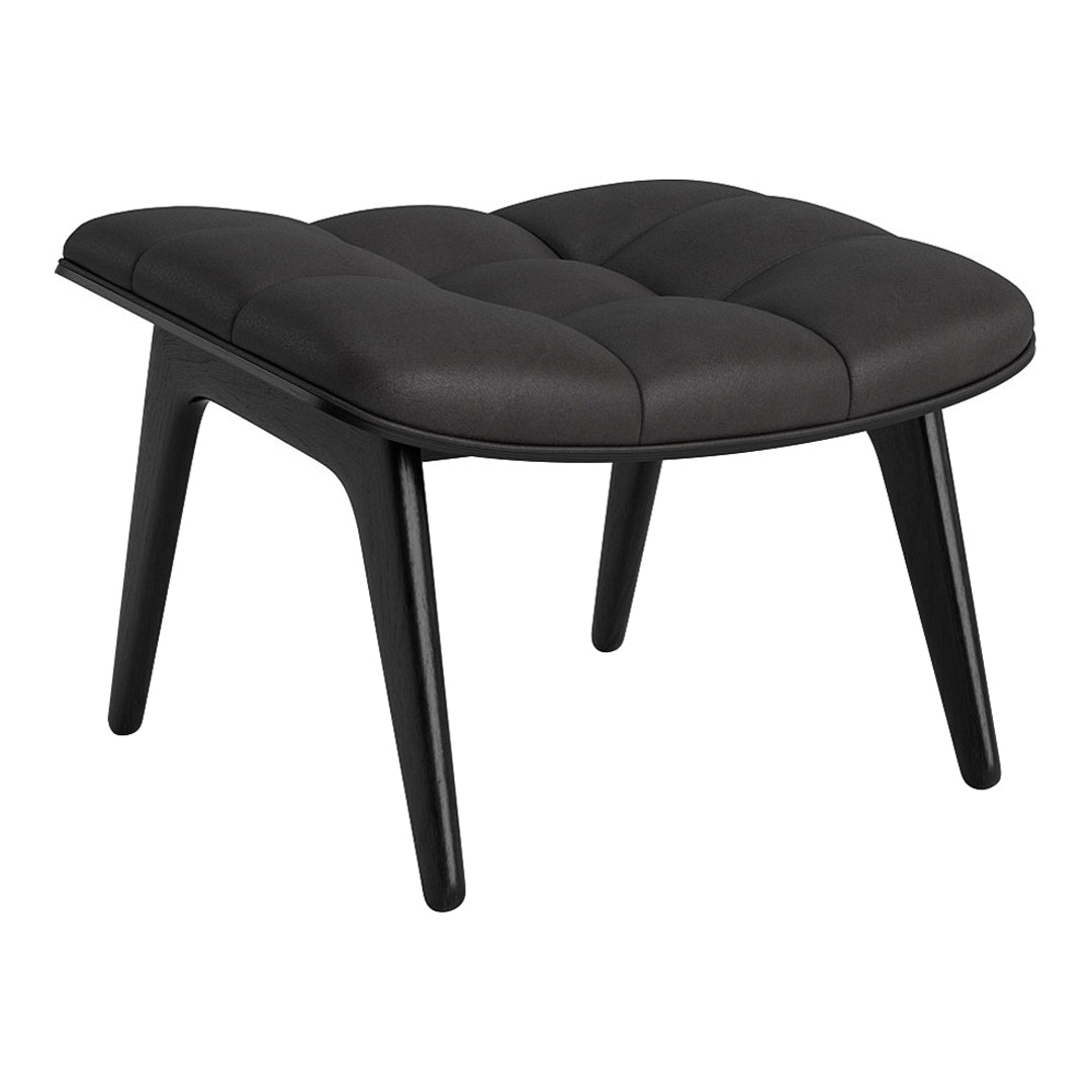 Black tufted ottoman with sleek wooden legs, showcasing a modern, minimalist design. Perfect for chic interiors.