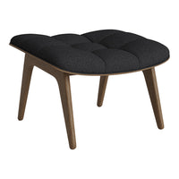 Black upholstered ottoman with tufted pattern and natural wood legs, adding a modern touch to any space.