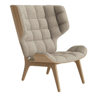 Beige tufted armchair with a unique high-back design and natural wood legs, adding a modern touch to any space.
