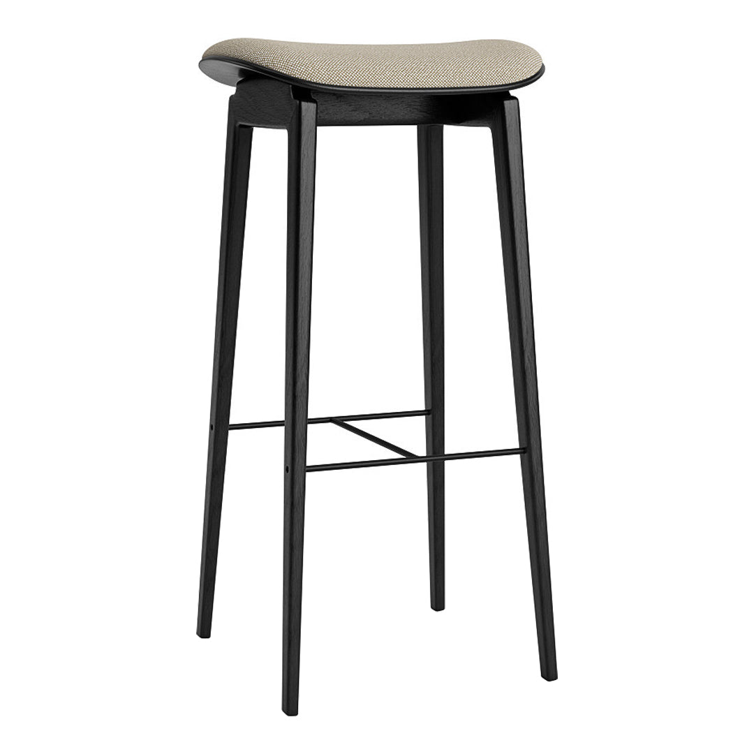 Black bar stool with a smooth, light beige cushioned seat, featuring sleek, minimalist design and slim legs.