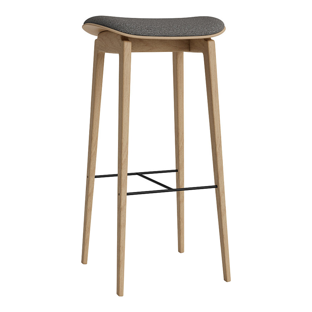 Light wood bar stool with a sleek gray upholstered seat and minimalist black metal footrest. Perfect for modern decor.