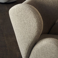 Textured beige upholstery with soft, curved contours, ideal for modern decor. Perfect balance of comfort and style.
