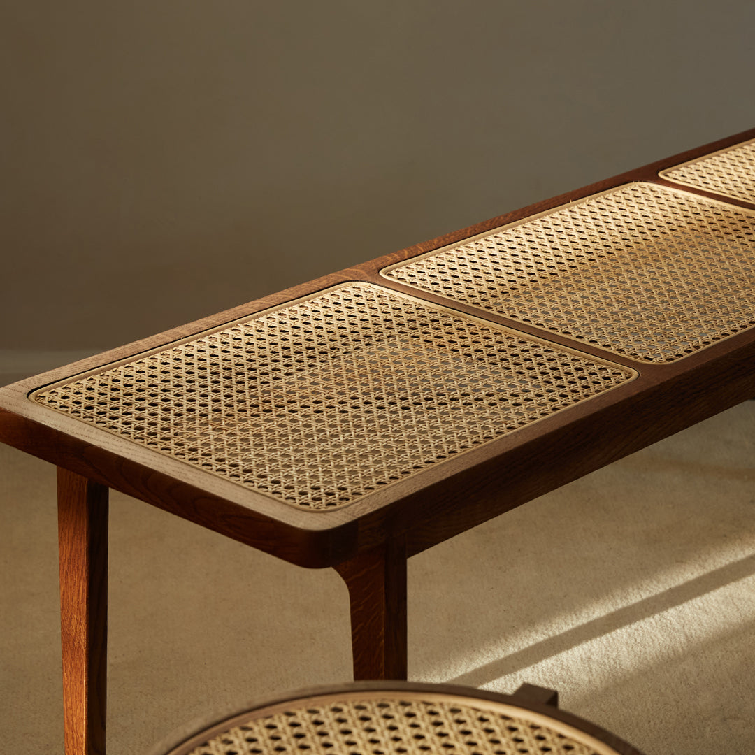 Stylish wooden table with a natural cane pattern and rich brown tones, adding elegance to any space.