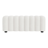 White upholstered bench with a ribbed texture and rounded edges, offering a modern and minimalist design.