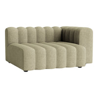 "Textured olive green sectional sofa with ribbed pattern, featuring a modern, curved design for stylish decor."