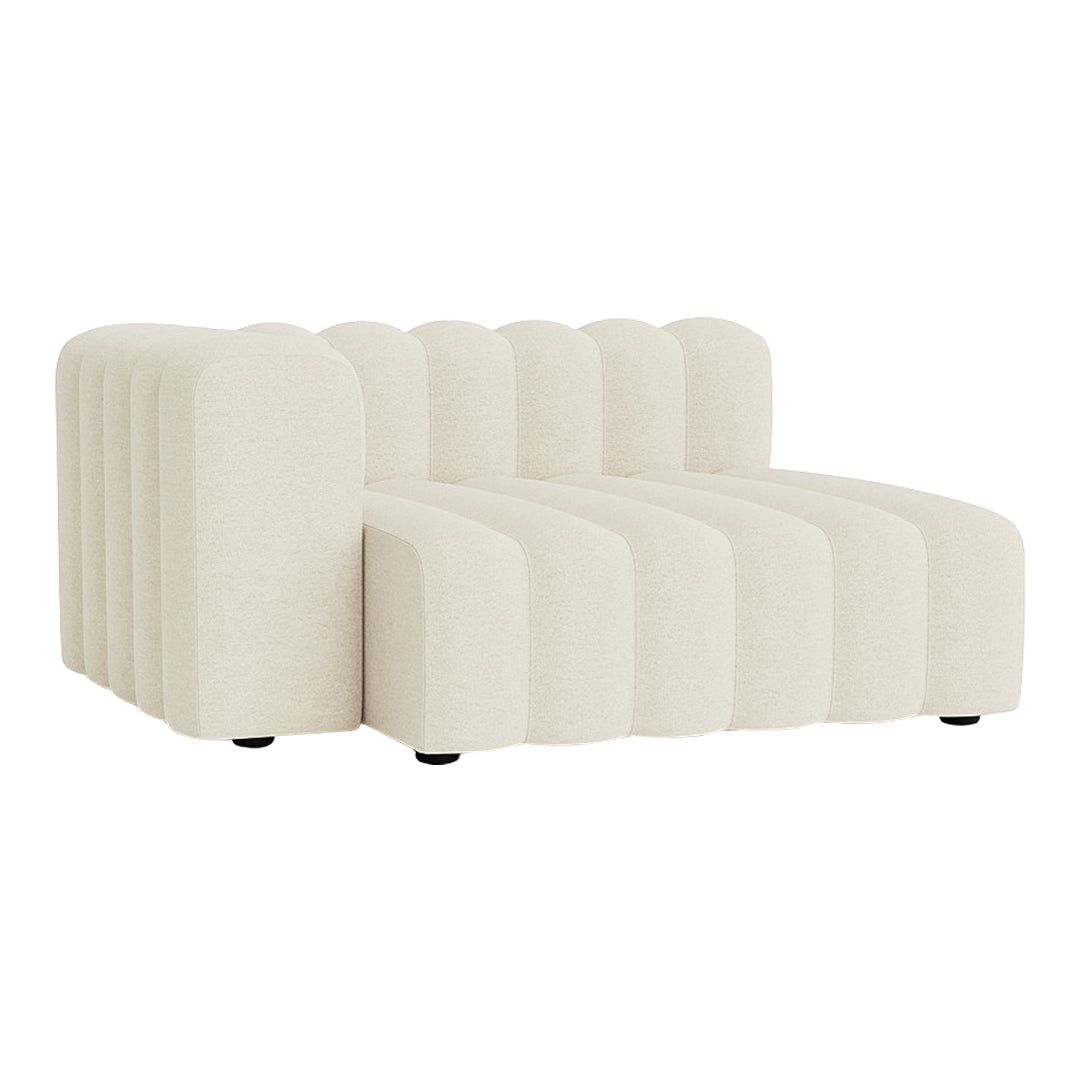 Beige curved sofa with textured vertical lines, featuring an inviting, modern design for stylish interiors.