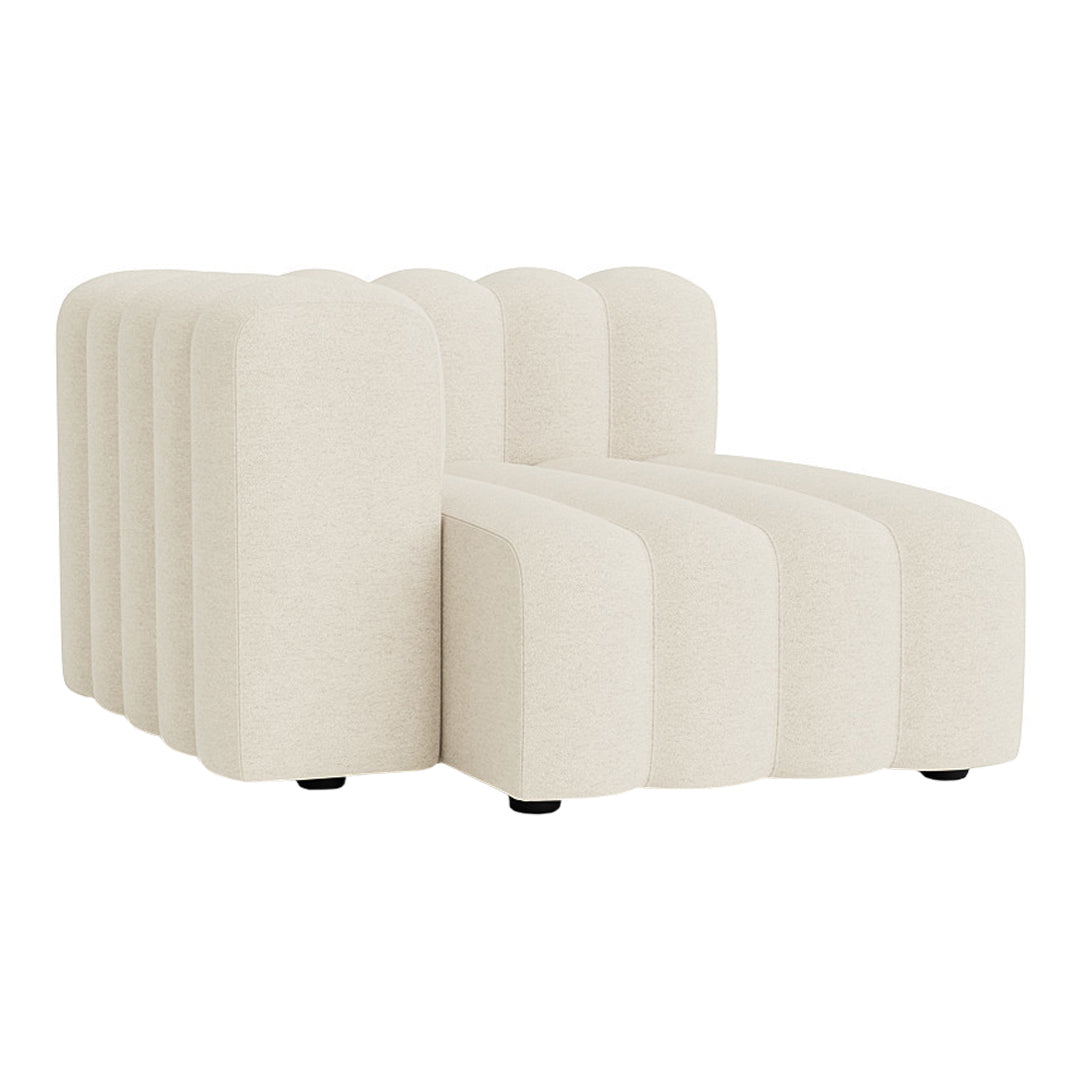 Elegant cream-colored sectional sofa with ribbed texture and smooth curves, perfect for modern interiors.