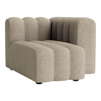 Modern beige sectional sofa with curved, ribbed upholstery pattern, ideal for contemporary living spaces.
