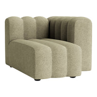 Light olive green sectional sofa with soft, curvy lines and a textured fabric pattern. Modern and stylish design.