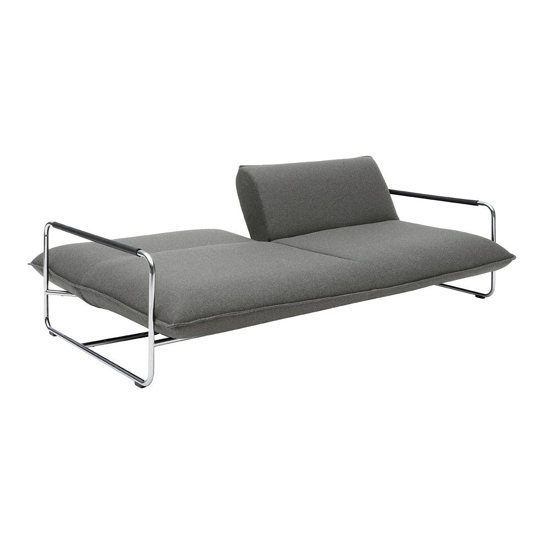 Modern gray sofa with sleek chrome legs, featuring a minimalist design and soft, smooth upholstery.