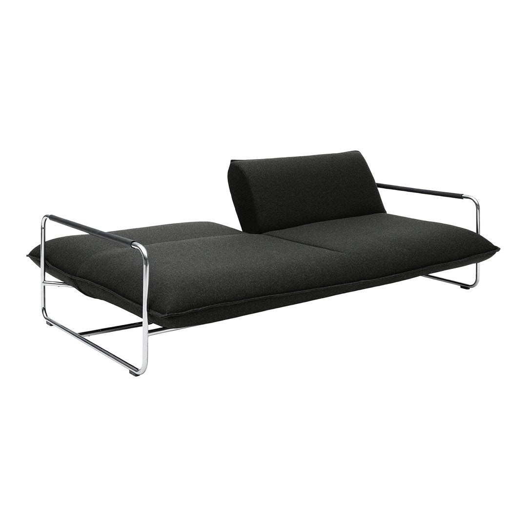 Black modern sofa with a sleek, minimalist design and chrome legs, featuring a solid fabric pattern.