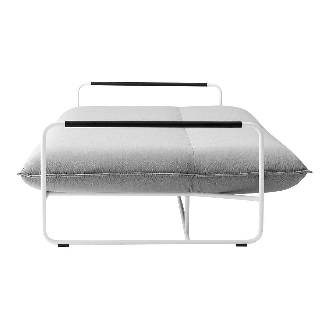 Gray fabric cushion with a sleek white frame and black accents. Modern minimalist design for contemporary decor.