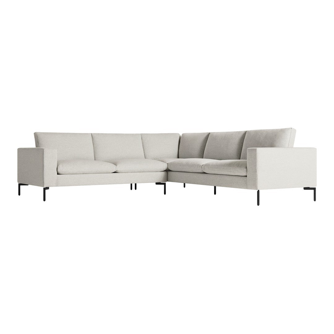 Light gray sectional sofa with clean lines and subtle texture, set on sleek black metal legs. Perfect for modern decor.