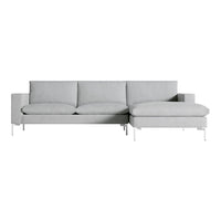 Light gray modern sofa with clean lines and a minimalist design, featuring soft fabric upholstery and sleek metal legs.