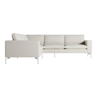 Light beige sectional sofa with a textured fabric and sleek white metal legs, featuring a minimalist design.
