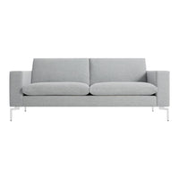 Light grey sofa with a minimalist design and plush cushions, featuring sleek white legs for a modern touch.